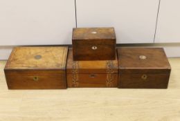 Three Victorian writing boxes and a tea caddy, largest 35cm wide, 15cm high, 24cm deep