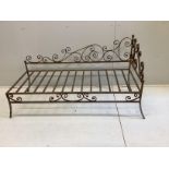 A wrought iron daybed, width 144cm, depth 60cm, height 80cm