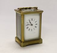 An early 20th century French lacquered brass carriage clock, cased