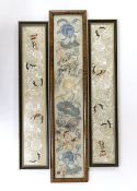 Three 19th century Chinese framed silk panels with embroidered decoration, largest 12 x 55cm