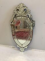 A Venetian style shield shaped etched glass wall mirror, width 72cm, height 138cm