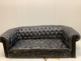 A Victorian and later buttonback leather Chesterfield settee, feet detached and in need of