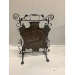 An Edwardian embossed copper and wrought iron fire screen, height 79cm