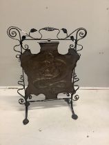 An Edwardian embossed copper and wrought iron fire screen, height 79cm