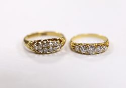 An Edwardian 18ct gold and two row diamond cluster set half hoop ring, size L and a yellow metal and