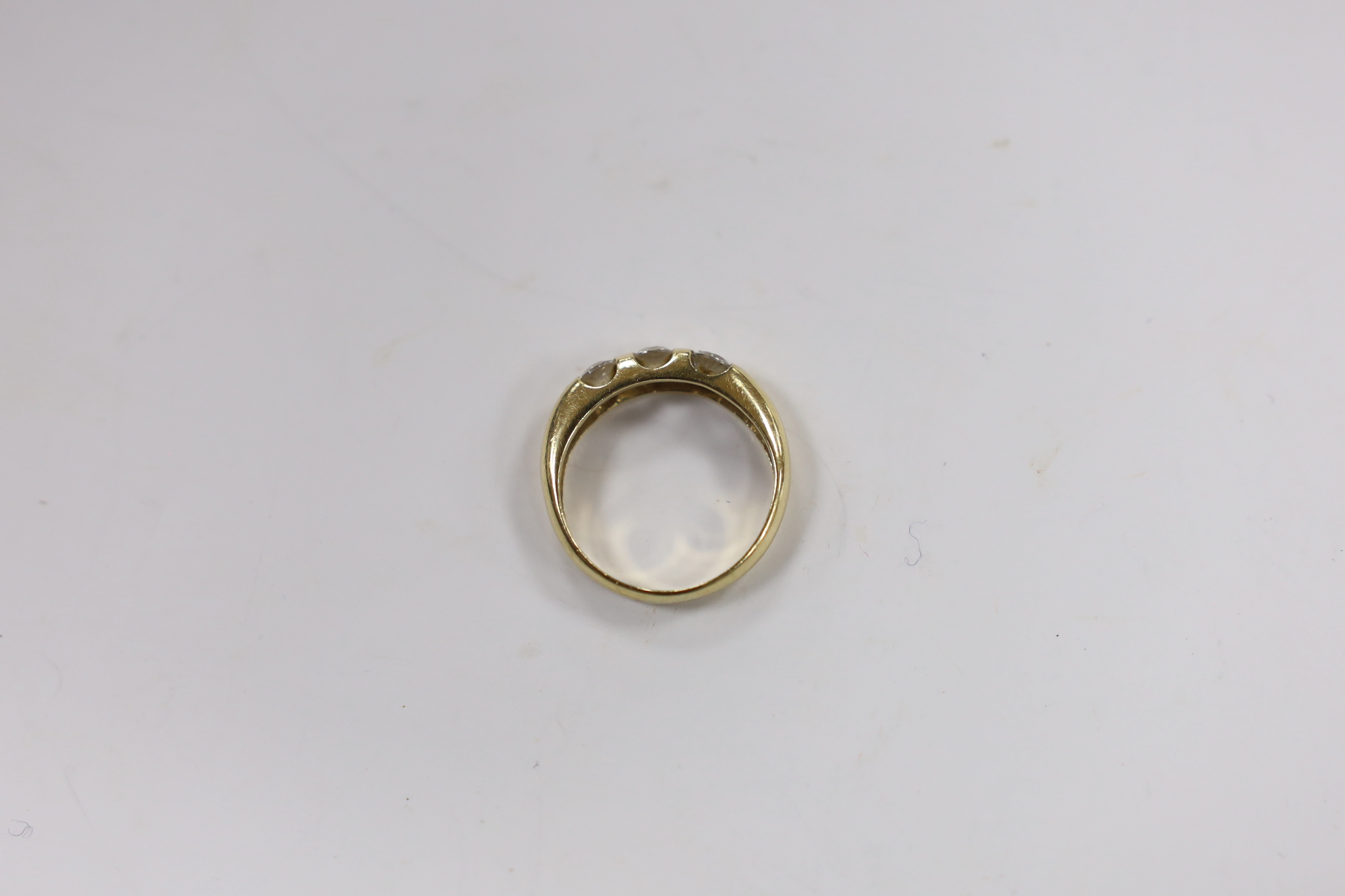 A yellow metal and three stone simulated diamond set ring, size K, gross weight, 2.7 grams. - Image 2 of 2