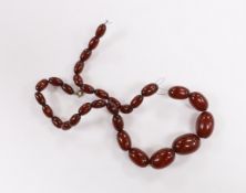A single strand graduated simulated cherry amber bead necklace, 44cm gross weight 35 grams.