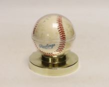 A Rawlings Costa Rica baseball autographed by Mickey Mantler, housed in a display case