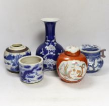 Two Chinese famille rose jars, a similar pot with cover, a brush pot and a vase, 18th century and