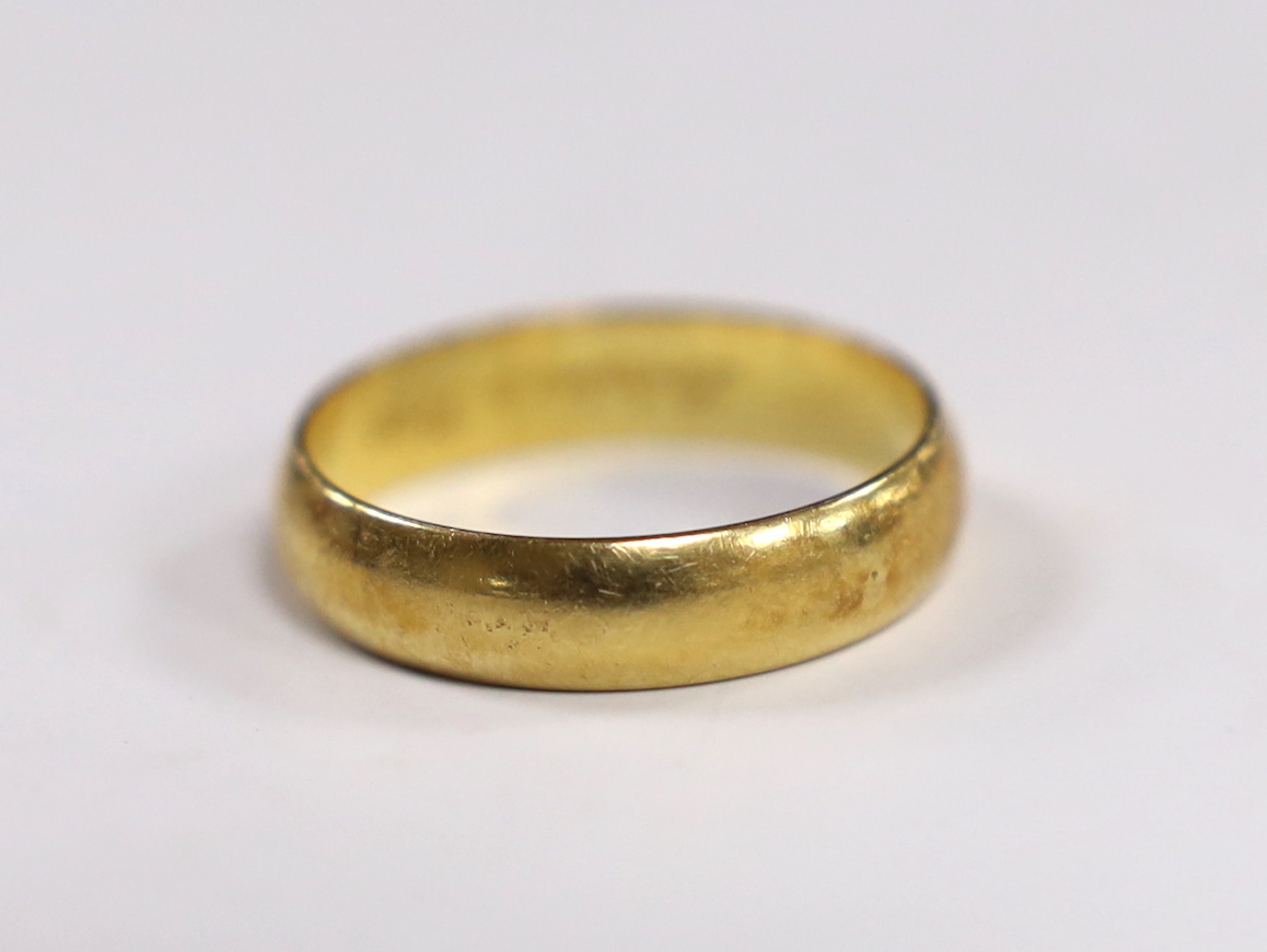 A modern Cartier 750 yellow metal wedding band, signed and numbered 62 JA 0005, with engraved
