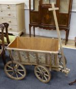 A vintage oak dog cart with later liner, length 78cm, depth 55cm, height 55cm