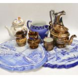 Nine ceramic items including two Dutch blue and white wall plaques, a silvered jug, a teapot, four