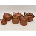 Six Chinese Yixing terracotta teapots, largest 11cm