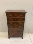 A Chinese elm four drawer chest with cupboard base, width 62cm, depth 35cm, height 109cm