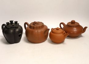 Four Chinese Yixing terracotta teapots, largest 10cm