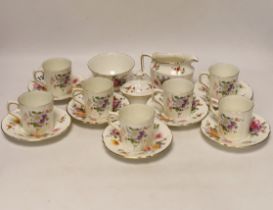 A Royal Crown Derby Posies coffee set comprising of seven cups and saucers, a sugar bowl and milk