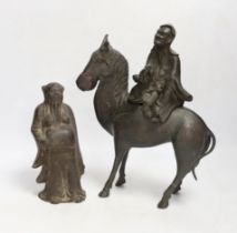 Two Chinese bronze figures, one of a luohan on his mule, the other a figure of a wise man, tallest