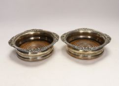 A pair of Victorian silver plated wine coasters, 17cm in diameter