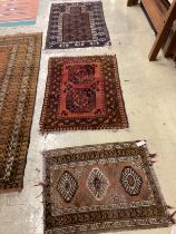 An antique Caucasian rug, an Afghan rug and a Belouch prayer rug, largest 140 x 86cm