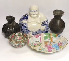 A Chinese blue and white buddha, 21cm, a famille rose dish and bowl and two vessels