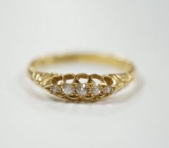 A Victorian 18ct gold and graduated five stone diamond chip set half hoop ring, size X, gross weight