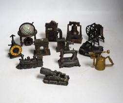 A collection of novelty metal pencil sharpeners and a pair of late Georgian silver plated