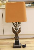 A Loevsky and Loevsky gilt metal ‘eagle’ table lamp with shade, 98cm total