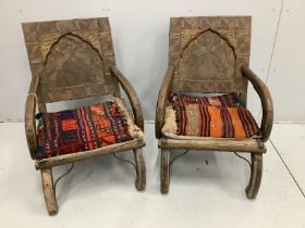 A pair of Indian metal clad low chairs with Kilim covered cushions, width 57cm, depth 48cm, height