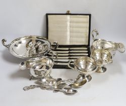 A small collection of silver including a sauceboat, two handled shallow bowl, five teaspoons and a