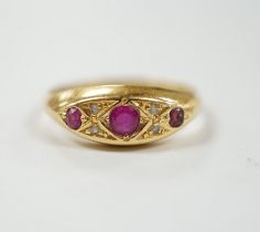 A George V 18ct gold, three stone ruby and four stone diamond chip set ring, size K, gross weight
