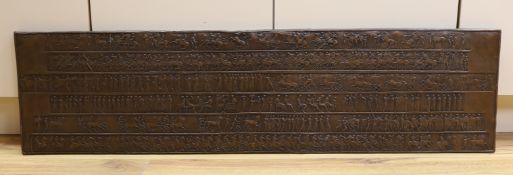 A copper effect resin plaque, 34 x 131cm