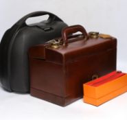 Hermes boxed red leather pen case, a Samsonite black hard plastic overnight case and a brown leather