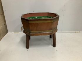 A George III style brass bound octagonal mahogany wine cooler, width 54cm, depth 39cm, height 49cm