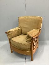 An Ercol oak armchair, width 82cm, depth 68cm, height 93cm