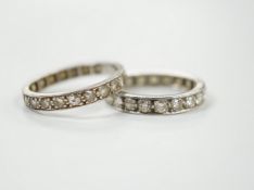 Two white metal and diamond set full eternity rings, one with cut shank and stone missing, sizes L &