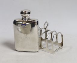 A small Edwardian silver hip flask, Chester, 1907, 10.4cm and a later silver five bar toast rack.