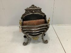 A George III style brass mounted cast iron and polished steel serpentine fire grate, width 46cm