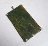 A Chinese carved spinach green jade panel,9cms high.