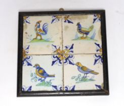 A 17th century Delft four-tile panel, polychrome-decorated with birds and with fleur-de-lys to