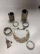 A collection of eight North African Berber white metal jewellery, etc, including bangles, cuffs