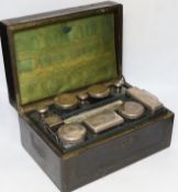 A Victorian vanity case with silver lidded jars, 35cm wide