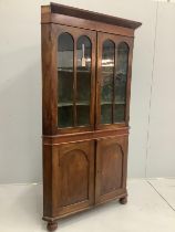 A George III mahogany and pine standing corner cupboard, width 102cm, depth 40cm, height 193cm