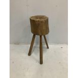 A Provincial trunk section chopping block on tripod stand, height 76cm