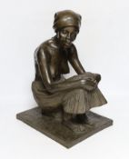 A bronzed resin figure of an African girl, signed J Cutler, 42cm high