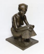 A bronzed resin figure of an African girl, signed J Cutler, 42cm high