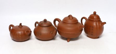 Four Chinese Yixing teapots, one slip decorated with a landscape, tallest 10.5cm Provenance- from