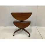 A Regency circular mahogany two tier drop flap occasional table, diameter 63cm, height 76cm