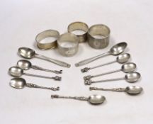 Four assorted silver napkin rings, six assorted silver coffee spoons including four with 'imp'
