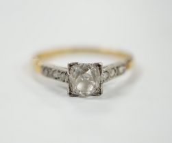 A 1920's yellow metal and single stone old mine cut diamond set ring, with six stone diamond set