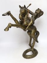 A Benin style bronze of a horse and rider, 51cm high